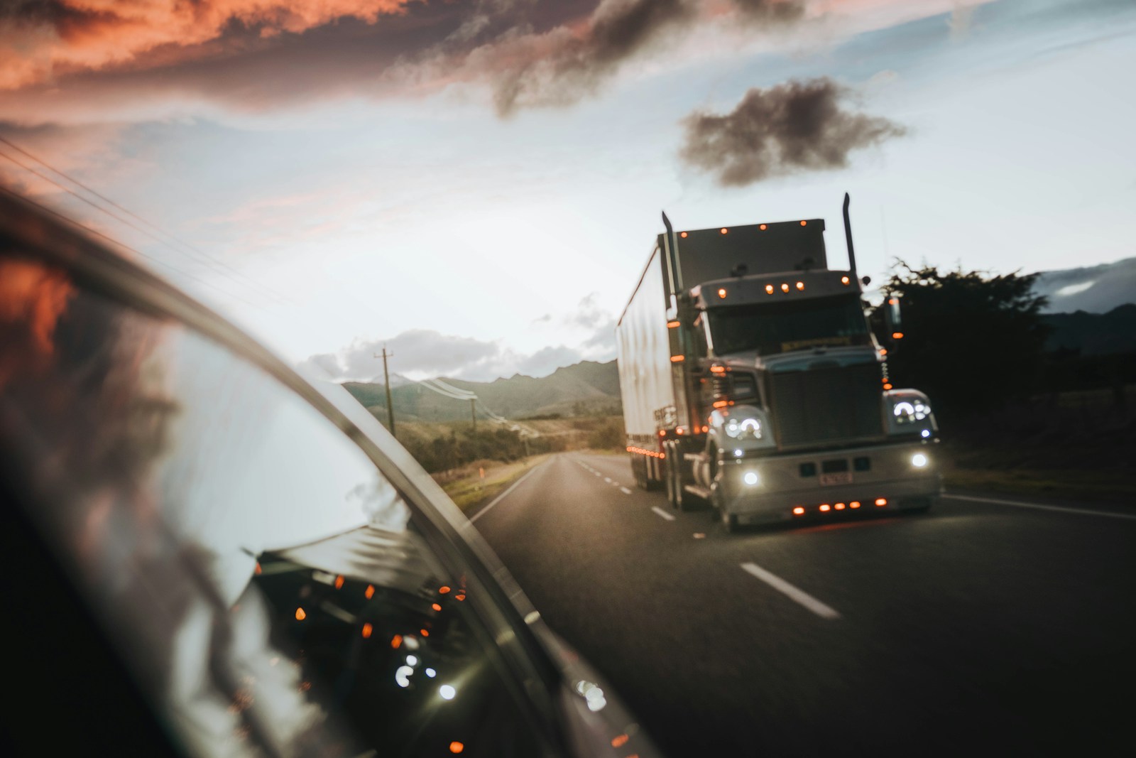 red truck on road during daytime, trucking